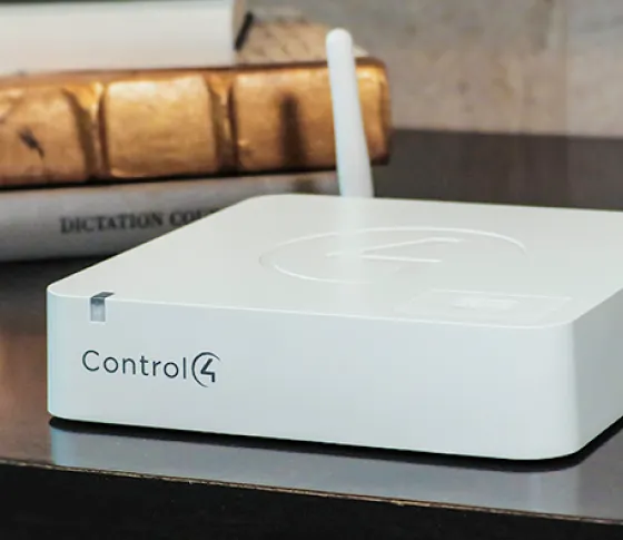 CA-1 controller on a desk next to decor.