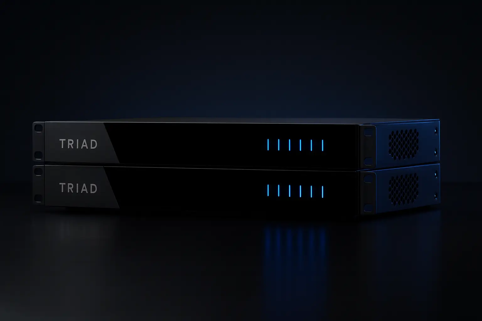 Rack-mounted Triad amplifiers on a light background.